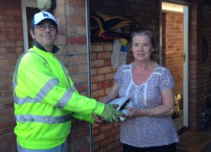 Wiser Recycling community collections of WEEE waste in Cambridgeshire - staff receiving items from householders